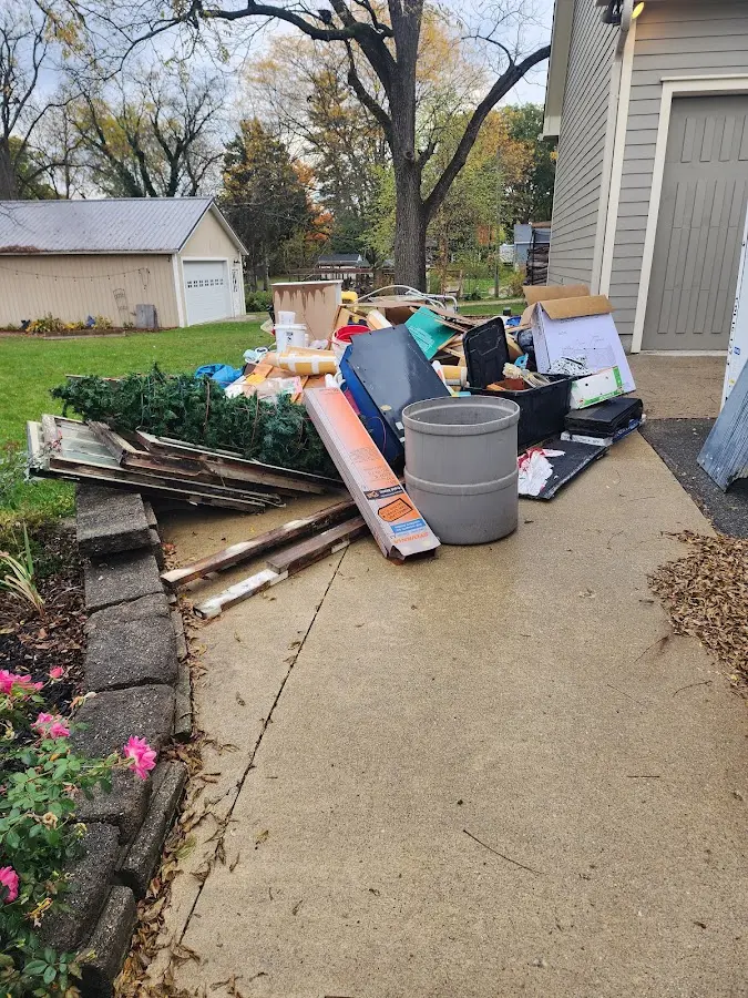 Dumpster being loaded with debris for 12 Yard Dumpster Rental in Coto de Caza